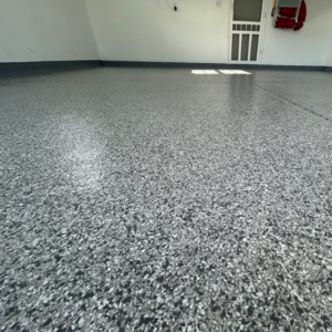 Close-up of garage floor with Meteor flake color from Galaxy Concrete.