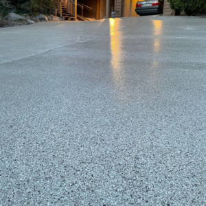 Close-up of driveway with Space Dust flake color from Galaxy Concrete.
