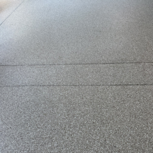 Close-up of patio floor with Milky Way flake color from Galaxy Concrete.