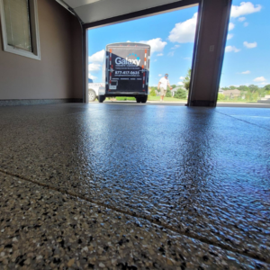Close-up of garage floor with Moon Rock flake color from Galaxy Concrete.