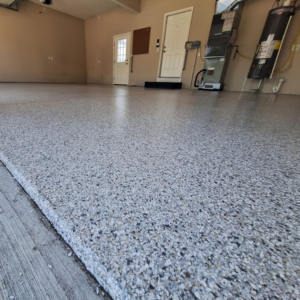 Close-up of garage floor with Neptune flake color from Galaxy Concrete.