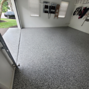 Garage floor with Eclipse flake color from Galaxy Concrete.