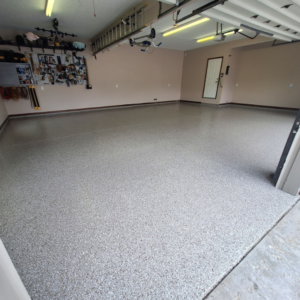 Garage floor with Neptune flake color from Galaxy Concrete.