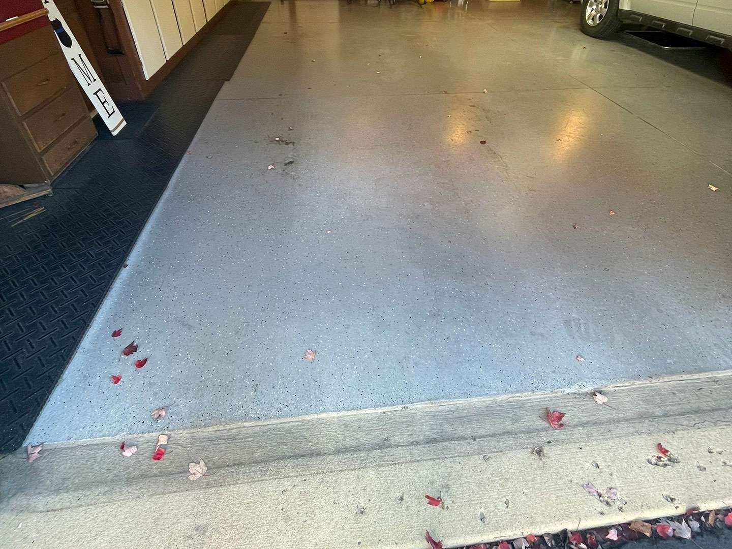 Garage floor that had epoxy coating on it